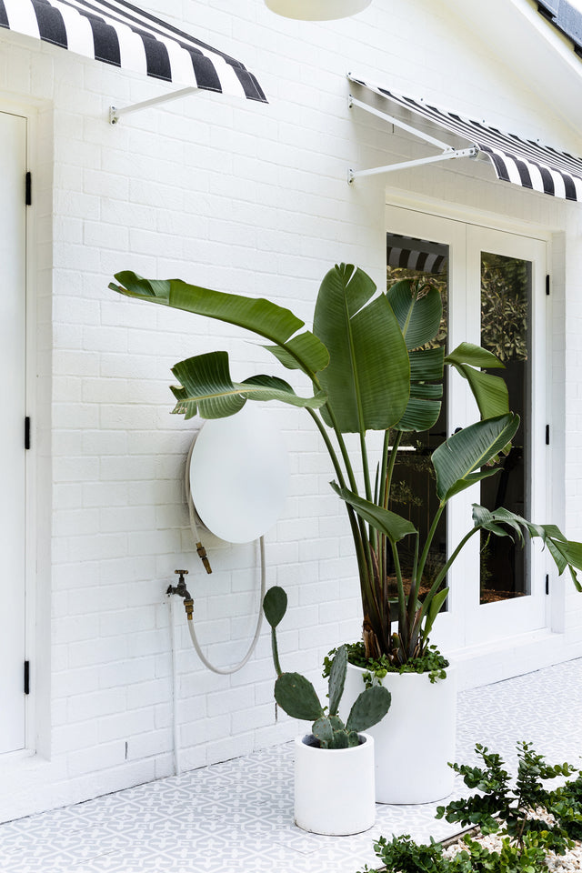 Adore Magazine Loni Parker Backyard Renovation | Dial Hose Hanger