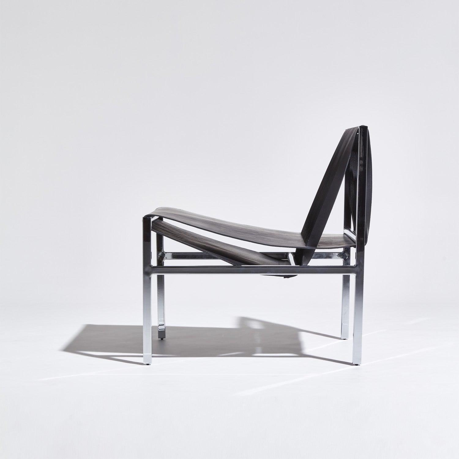 DL Lounge Chair & Bench by Dion Lee, Sarah Gibson & Nicholas Karlovasitis | Saddle Leather & Chrome | DesignByThem