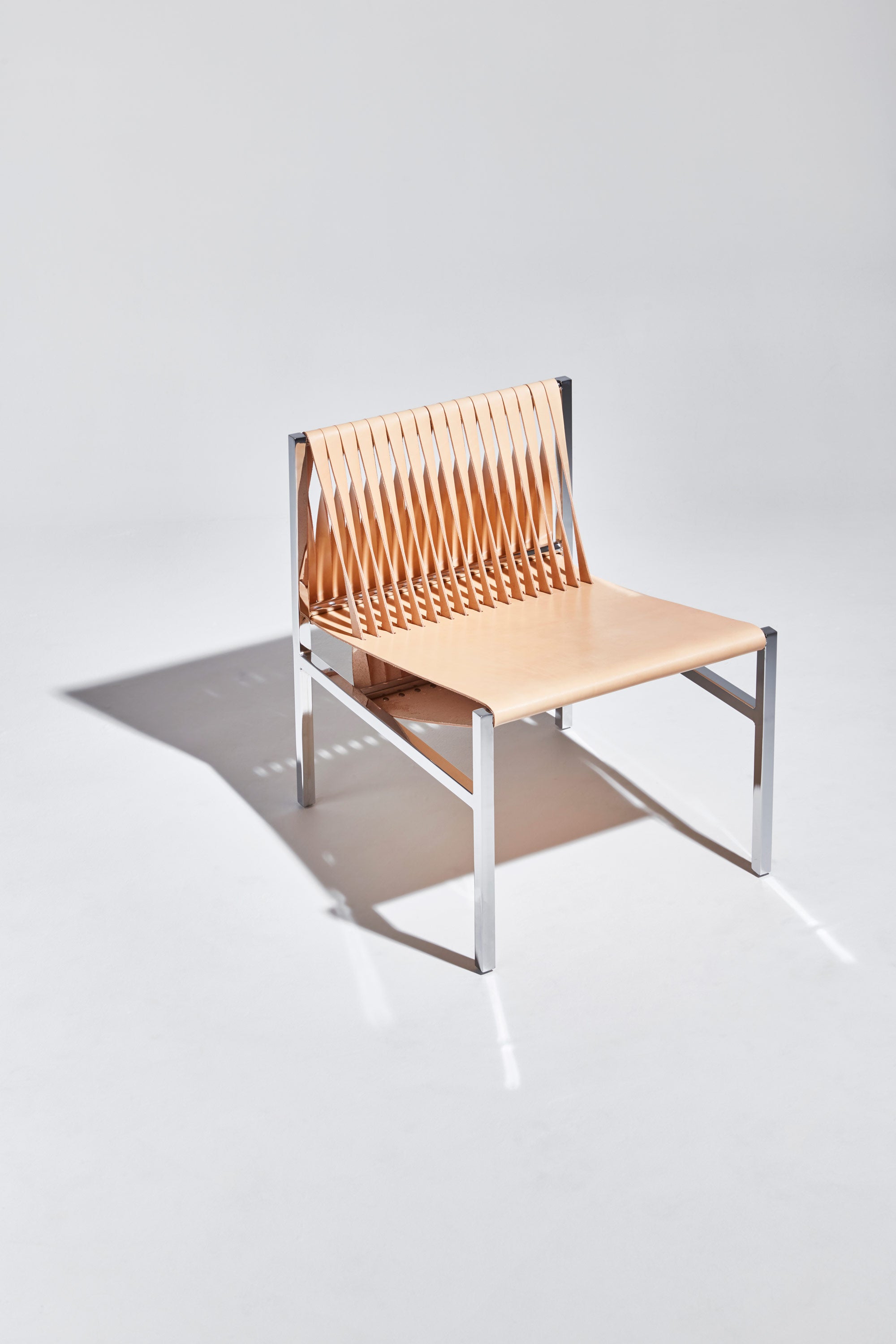 DL Lounge Chair by Dion Lee, Sarah Gibson & Nicholas Karlovasitis | Saddle Leather & Chrome | DesignByThem